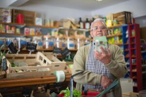Elderly man lebel reading food product
